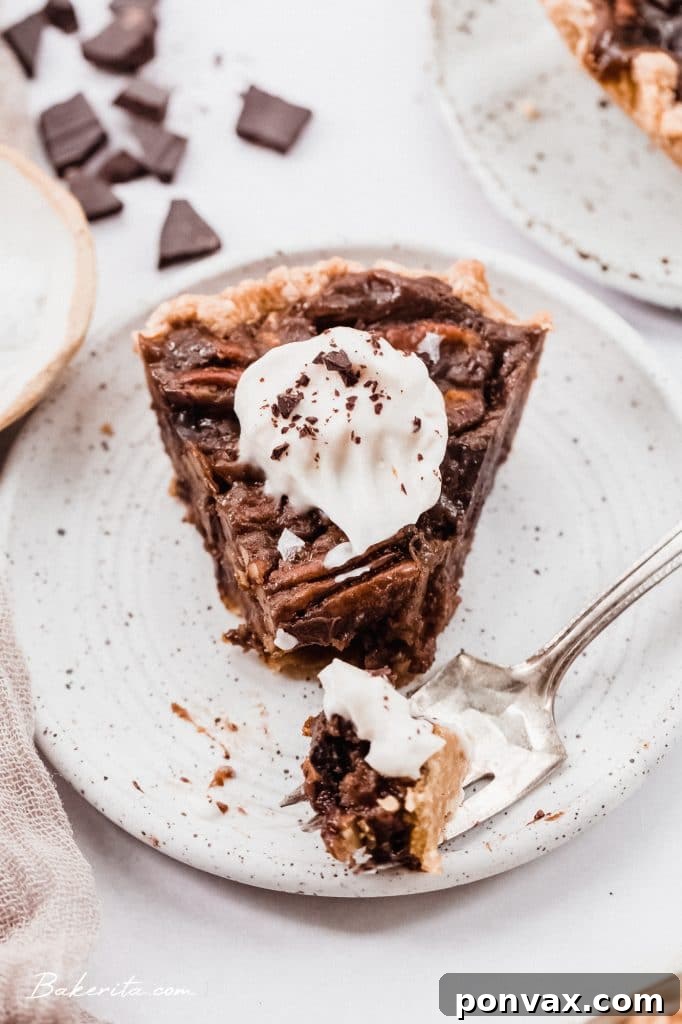A baked Vegan Chocolate Pecan Pie cooling on a wire rack.