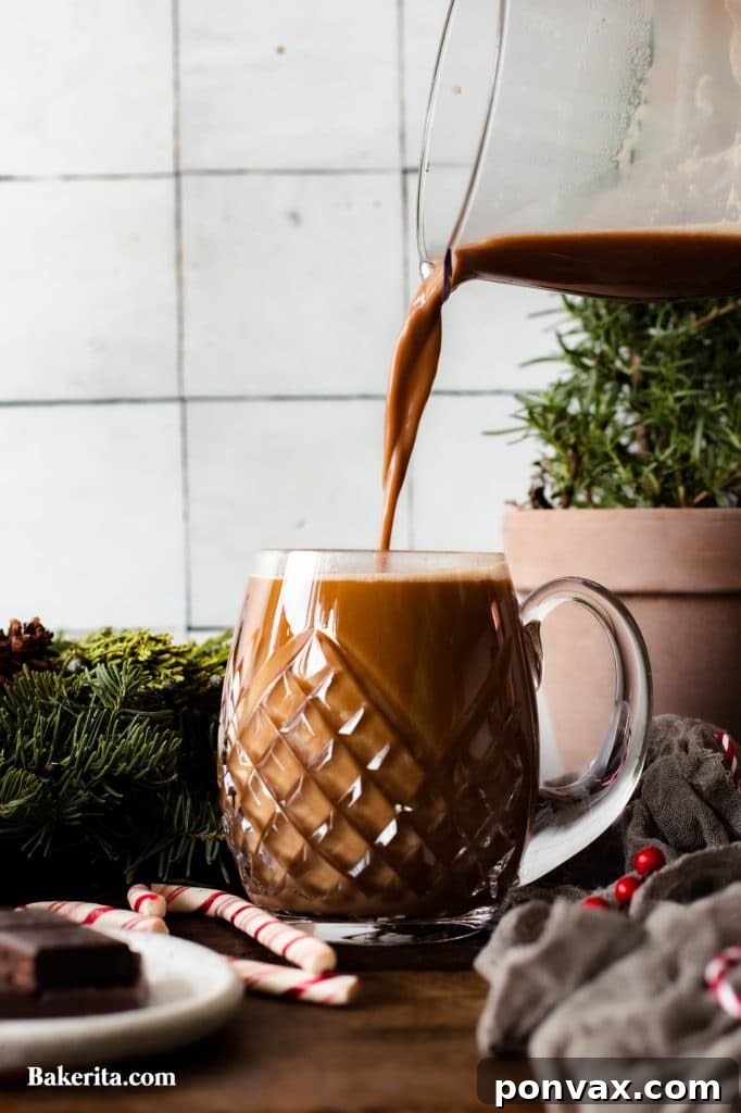 Seasonal Sips: Peppermint Mocha, London Fog, and Salted Cashew Hot Chocolate 3 Close-up of a London Fog Tea Latte with a cozy background.