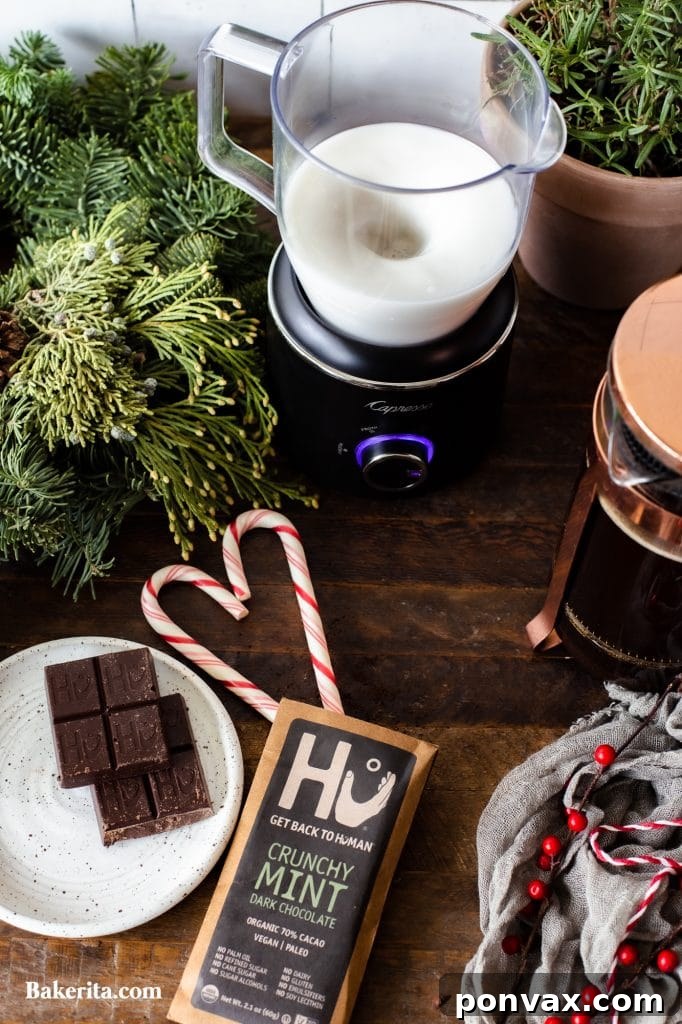 Seasonal Sips: Peppermint Mocha, London Fog, and Salted Cashew Hot Chocolate 5 A Peppermint Mocha drink garnished with candy cane.