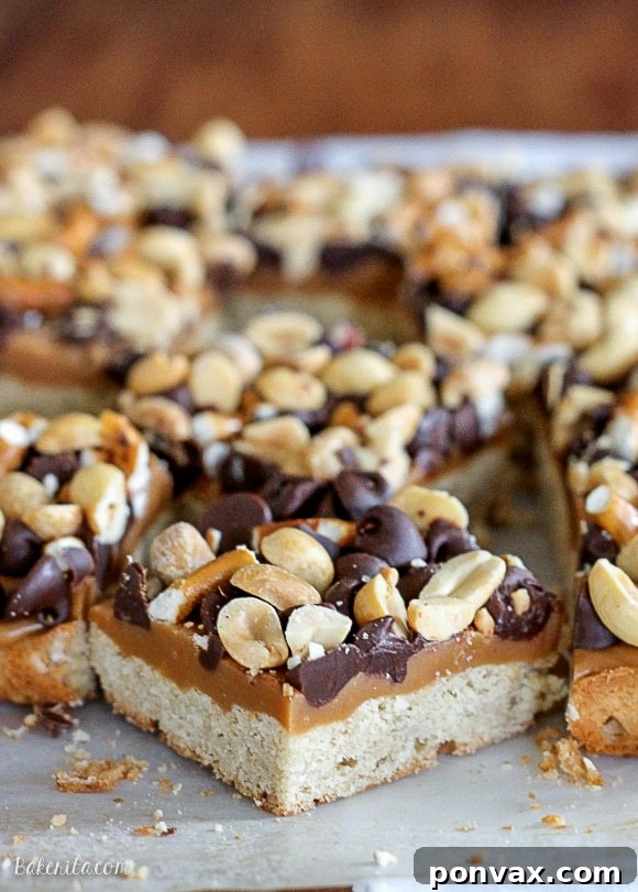 Stacked Flavor Bars 5 A platter of freshly baked Fully Loaded Bars, some cut to show the distinct layers, perfect for a holiday gathering.