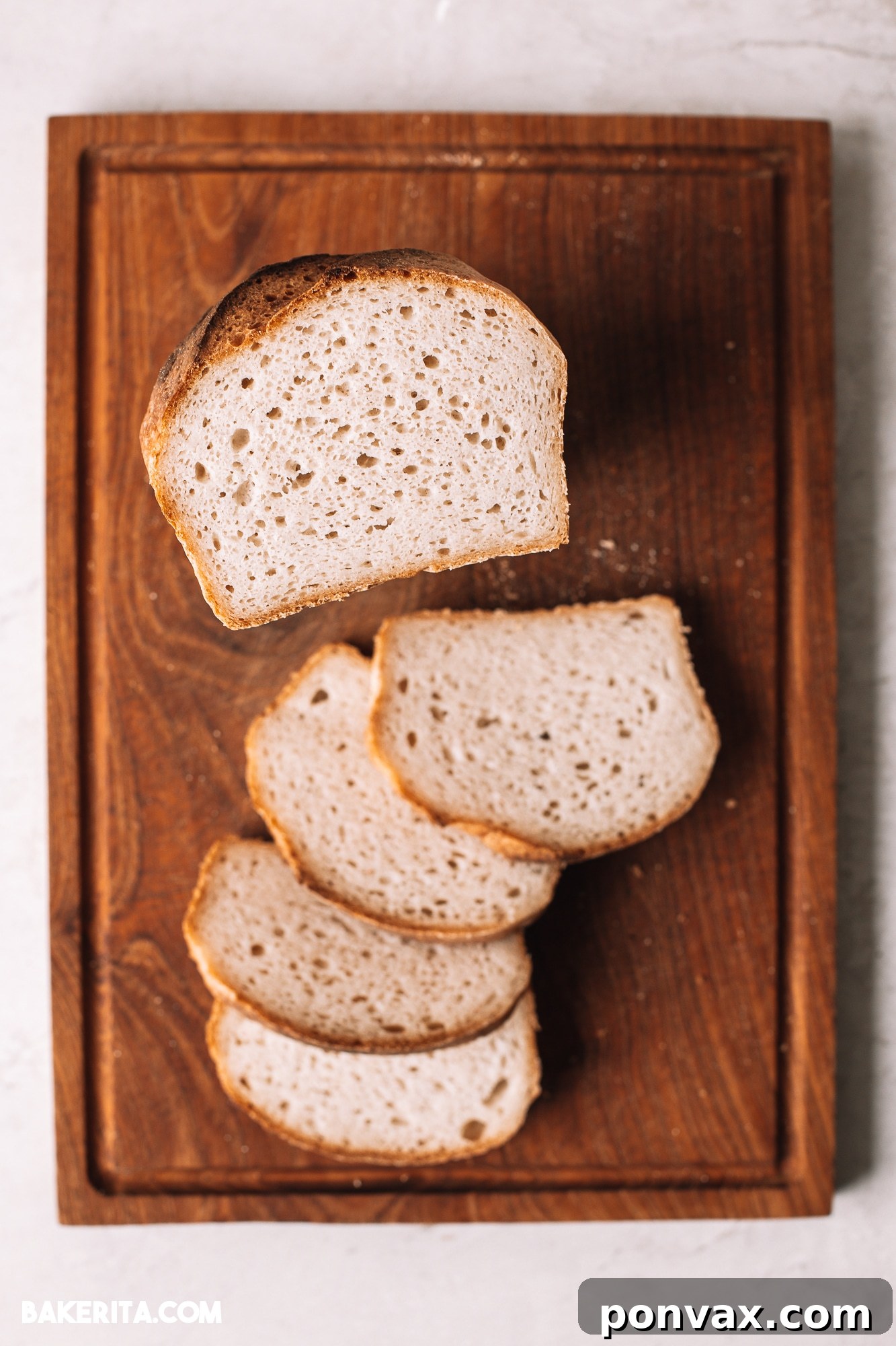 Crafting Perfect Gluten-Free Sourdough 12 A perfectly baked gluten-free sourdough loaf cooling on a wire rack, steam gently rising.
