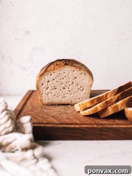 Beautifully scored and baked gluten-free sourdough bread, ready to be enjoyed.