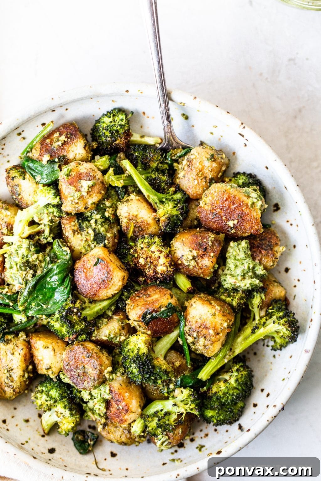 Pillowy Vegan Cauliflower Gnocchi with Fresh Pesto 7 Serving of Vegan Cauliflower Gnocchi with Pesto on a plate, ready to eat