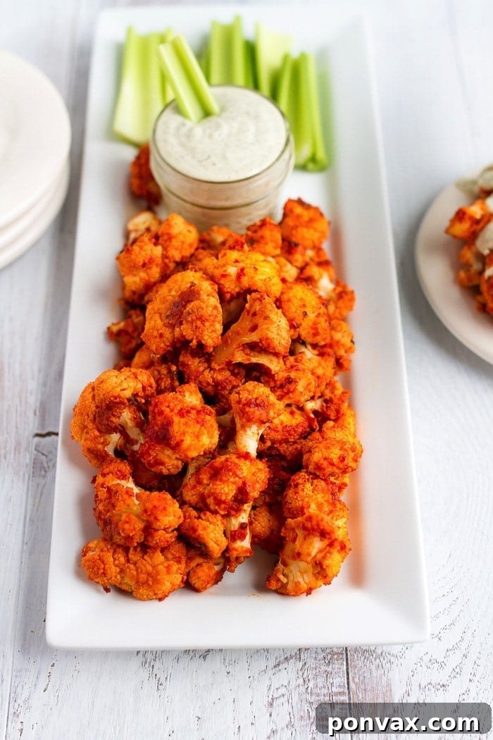 Vegan Super Bowl Feast: Over 50 Game Day Recipes 13 Buffalo Cauliflower Wings from Eating Bird Food, a delicious, easy, gluten-free, and paleo-friendly game day appetizer with almond flour batter.