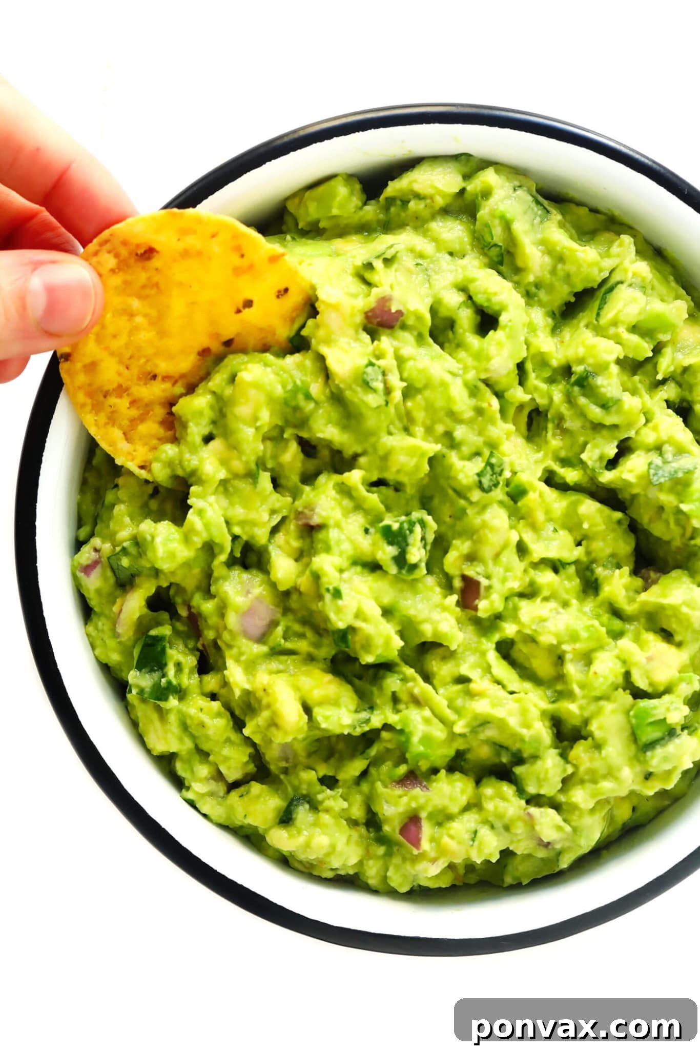 Vegan Super Bowl Feast: Over 50 Game Day Recipes 15 The Best Guacamole from Gimme Some Oven, combining creamy avocados, fresh cilantro, lime, and jalapeno, perfect for chips, nachos, or taco bowls.