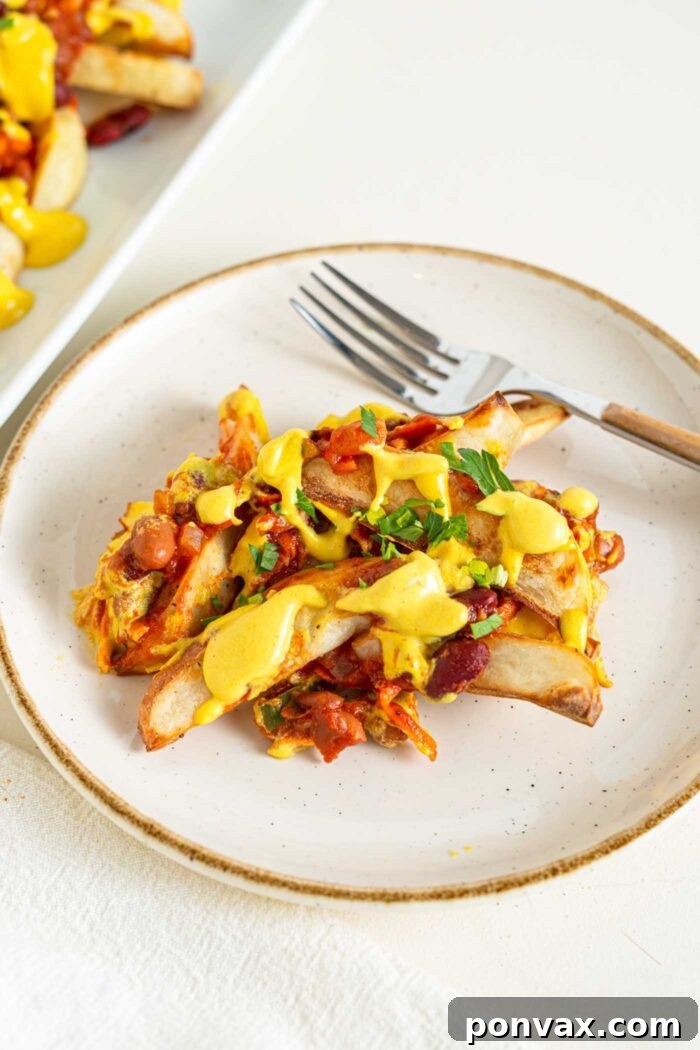 Vegan Super Bowl Feast: Over 50 Game Day Recipes 16 Vegan Chili Cheese Fries from Running on Real Food: healthier with baked potato fries, creamy cashew cheese, and homemade chili sauce. Dreamy game day food!