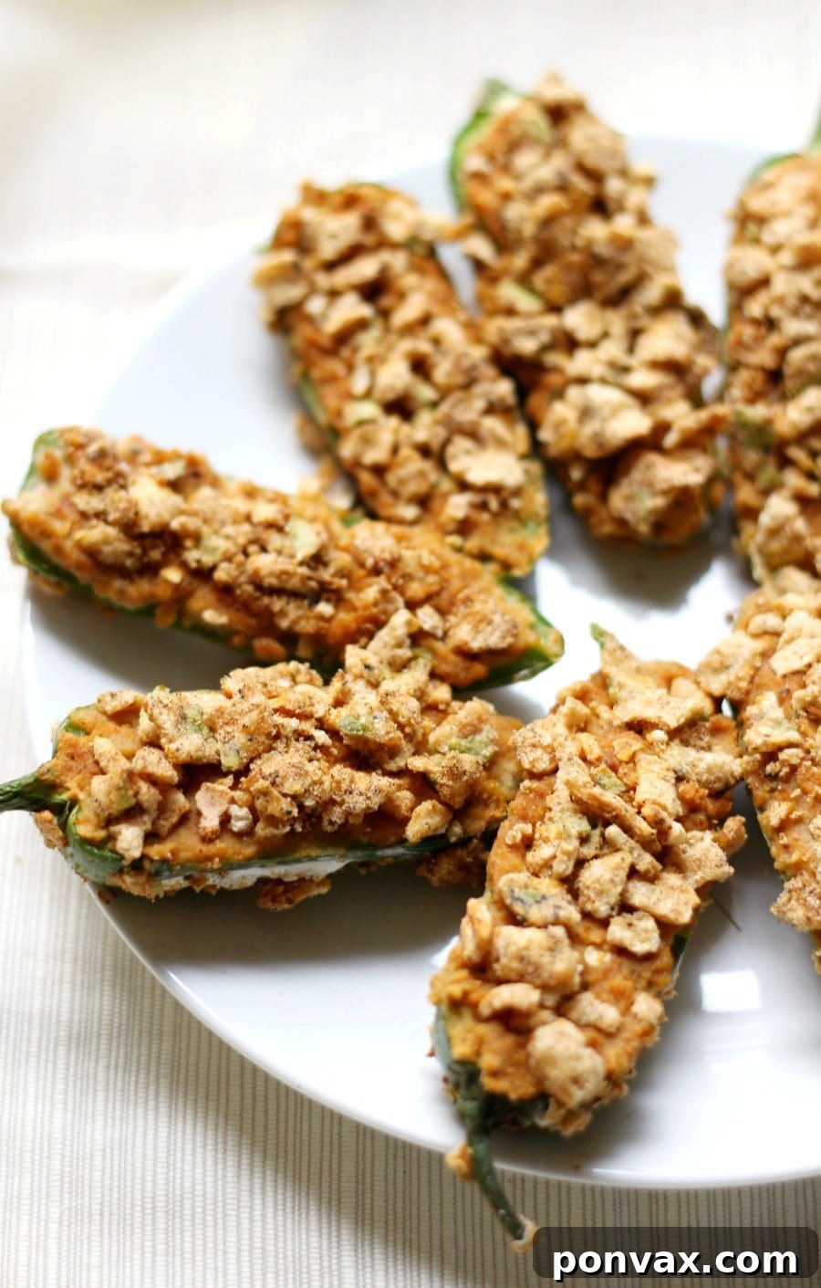 Vegan Super Bowl Feast: Over 50 Game Day Recipes 17 Gluten-free Baked Jalapeño Poppers from Strength & Sunshine: healthier, stuffed with creamy hummus, and baked for game day perfection.