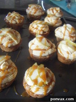Close-up of a caramel apple cupcake with a swirl of caramel frosting