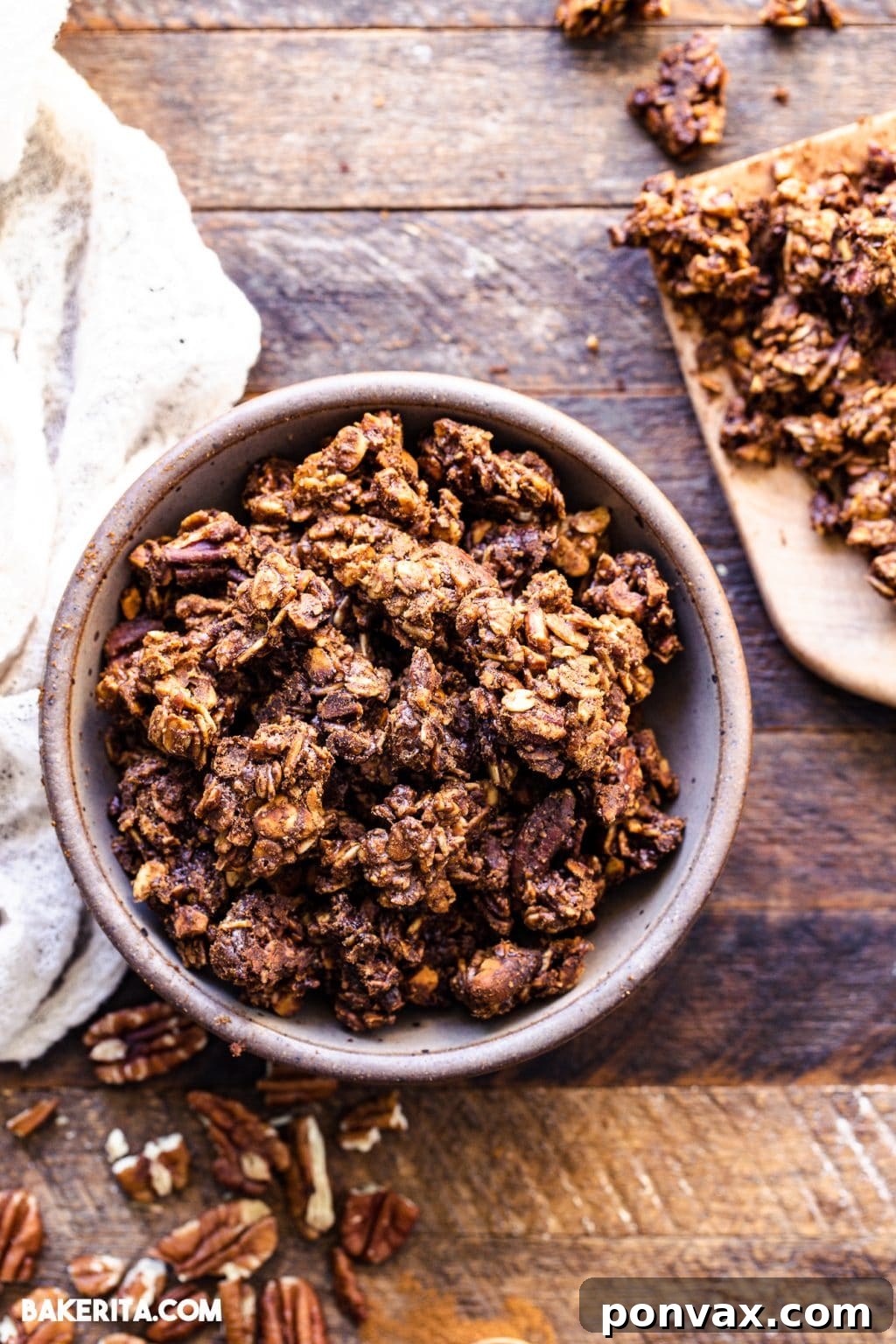 A close-up shot of vegan gingerbread cookie granola in a bowl, showcasing its crunchy texture and warm hues.