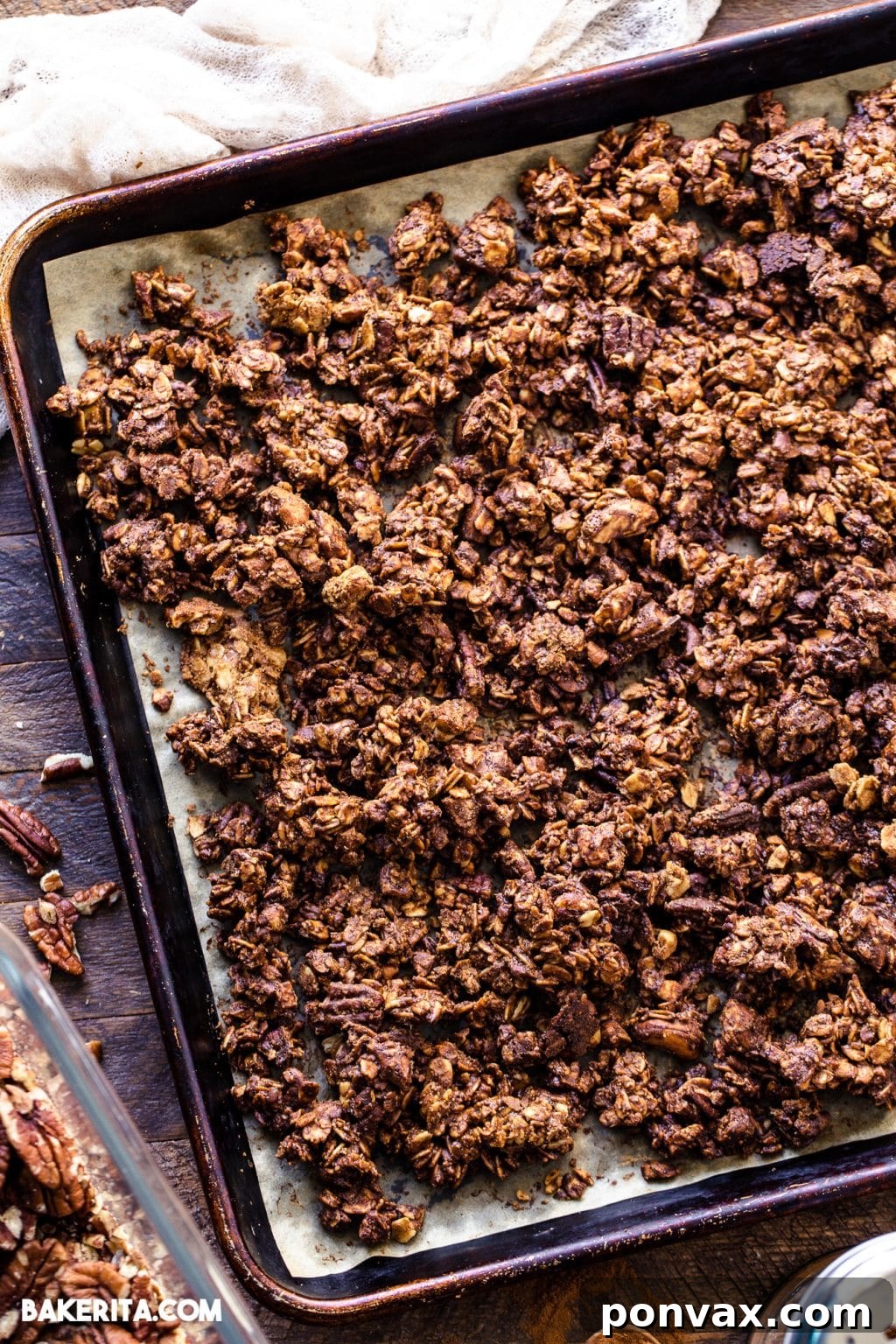 A bowl of easy vegan gingerbread cookie granola served with a spoon, highlighting its inviting texture.