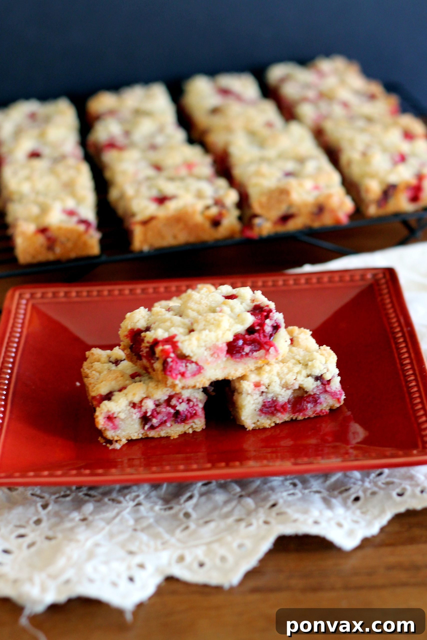 Freshly baked Cranberry Crumb Bars cooling on a wire rack, ready to be cut into squares.