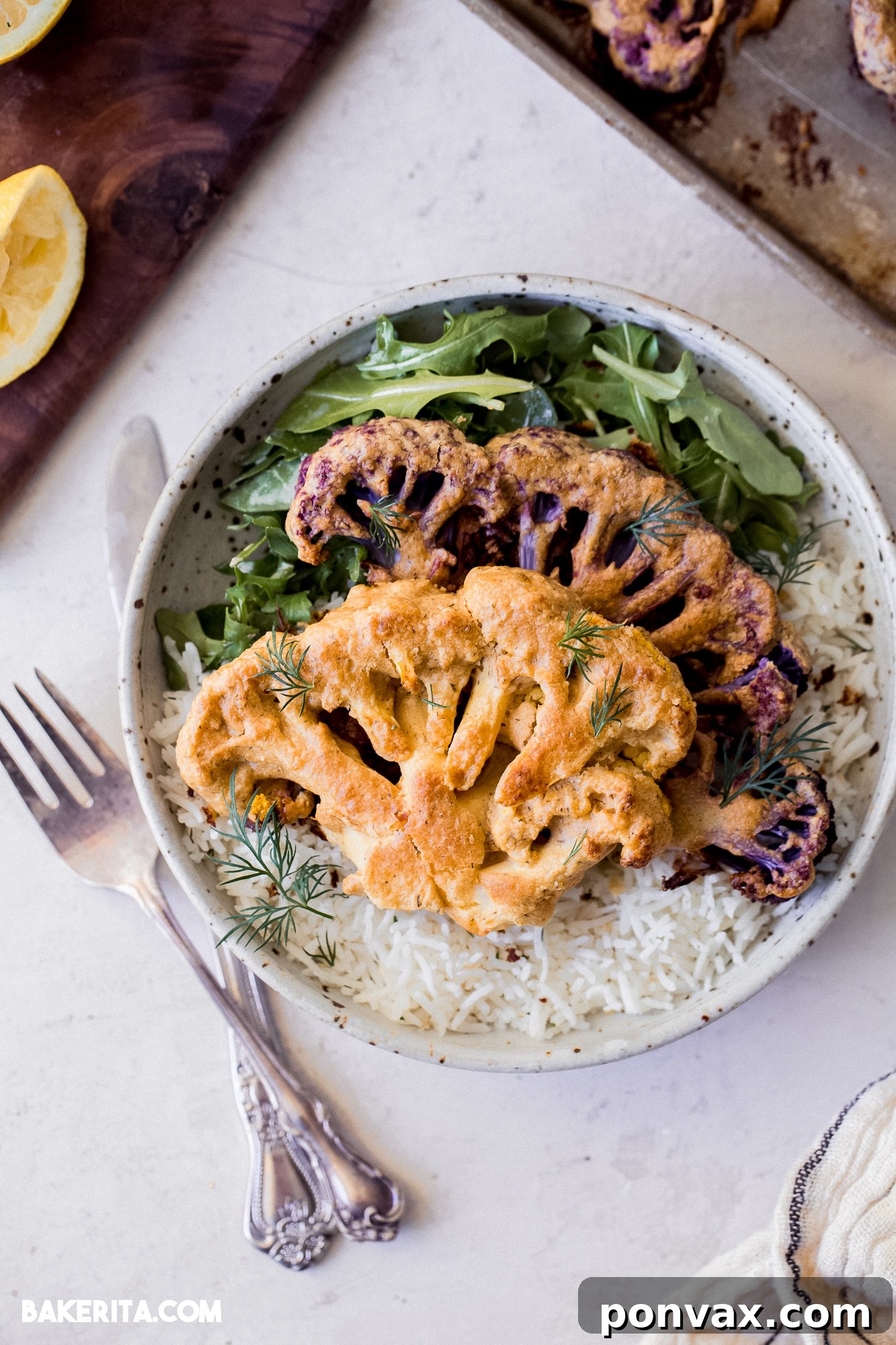 Close-up of a perfectly roasted Vegan Tahini Cauliflower Steak, showing its golden-brown crust and tender interior.