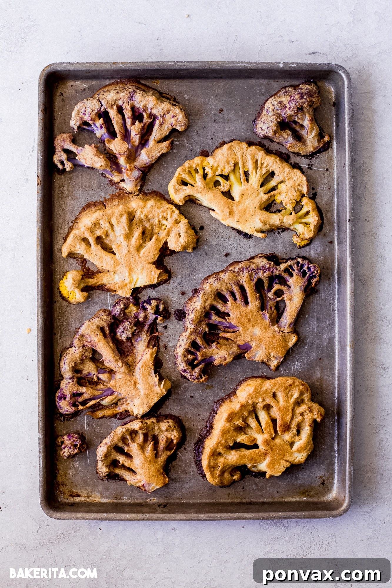 Close-up of the smooth and creamy tahini sauce in a bowl, with a whisk.