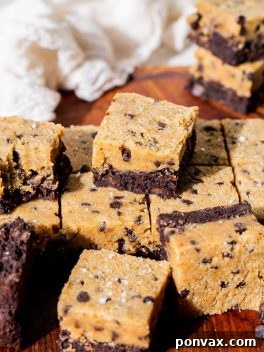 Decadent Vegan Gluten-Free Cookie Dough Brownies 2 A stack of perfectly cut Gluten-Free Vegan Cookie Dough Brownies, showing the distinct brownie and cookie dough layers, with chocolate chips visible.