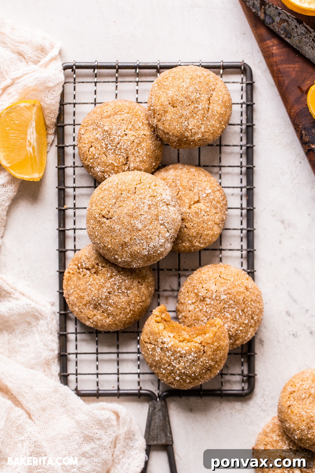 Zesty Soft Chewy Vegan Lemon Cookies 5 Vegan Gluten-Free Lemon Cookie dough balls rolled in sugar, ready for baking on a parchment-lined baking sheet.