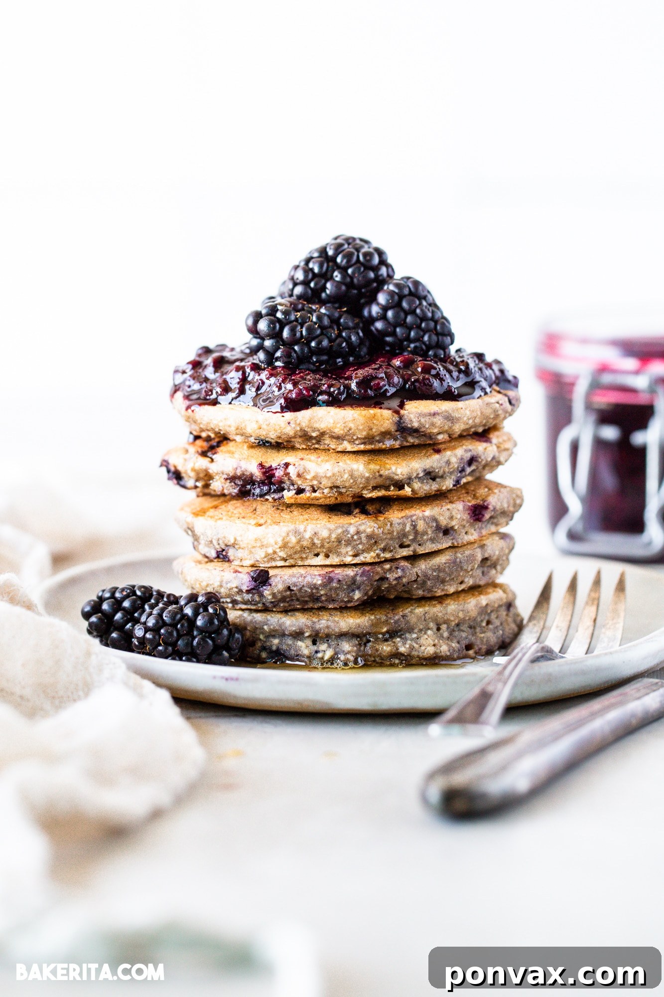 Berrylicious Vegan GF Pancakes 6 Gluten-free vegan blackberry pancakes cooking on a griddle.