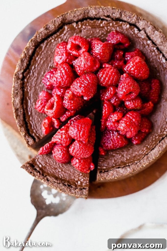 Super creamy baked vegan chocolate cheesecake with a rich chocolate flavor and gluten-free crust.