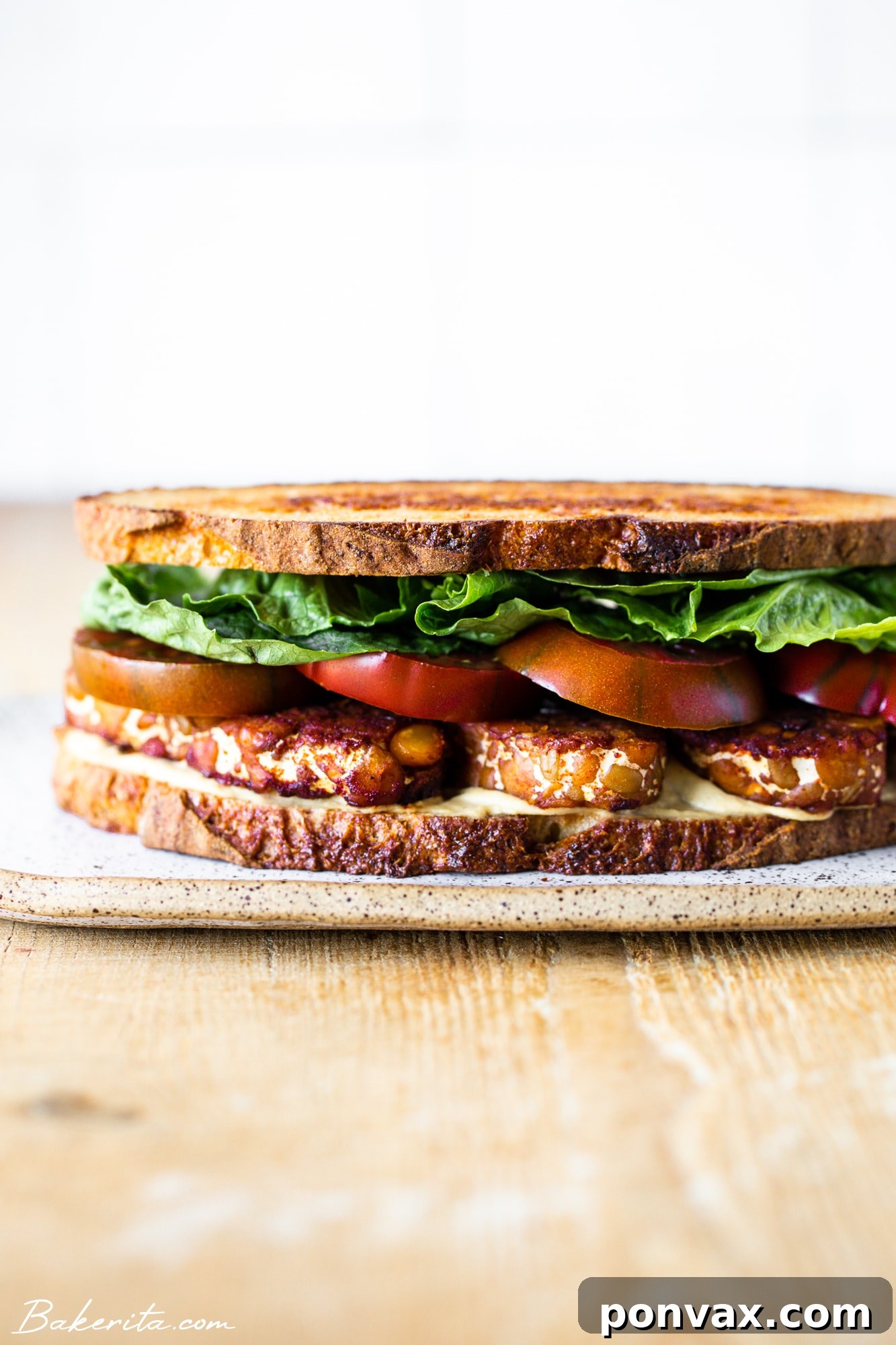 Close-up of crispy tempeh bacon slices, marinated to perfection.