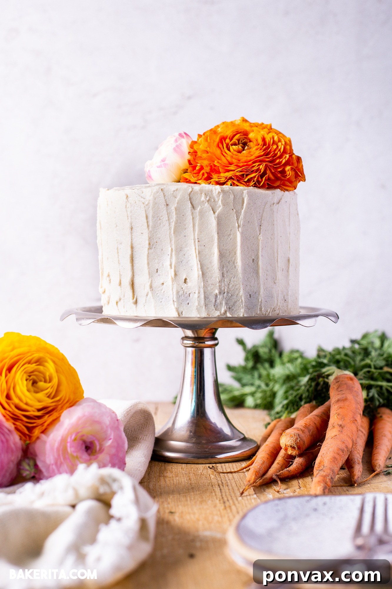 A beautifully decorated gluten-free vegan carrot cake with cream cheese frosting, ready to be served.