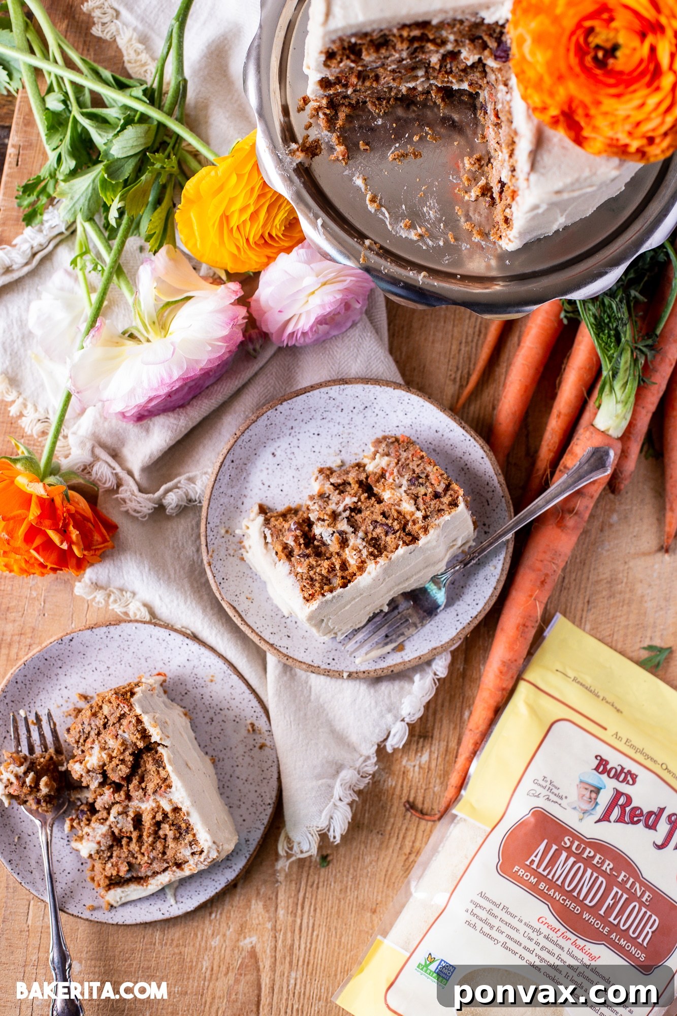 Close-up of the vegan cream cheese frosting being spread on a layer of gluten-free vegan carrot cake.