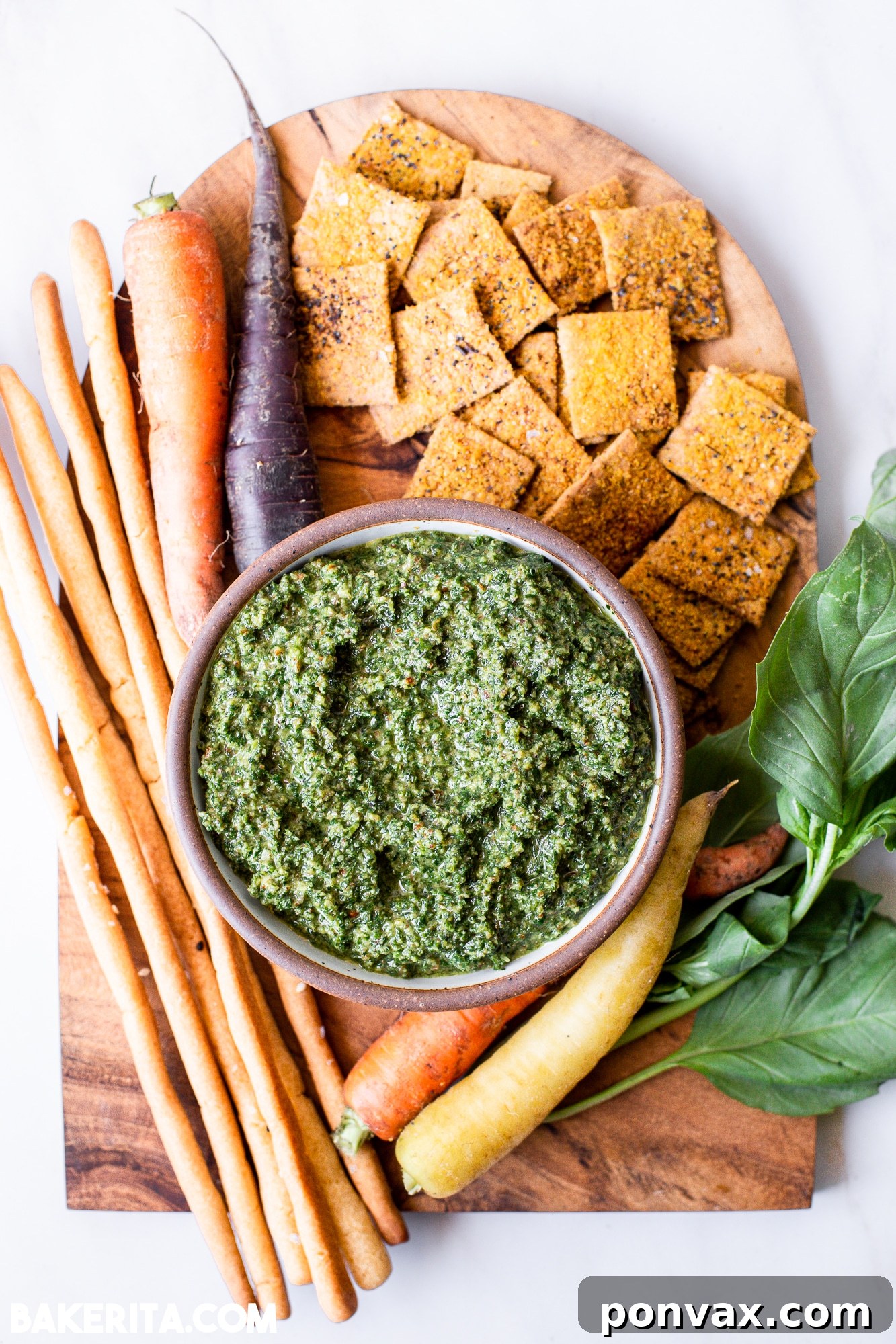 Zero-Waste Vegan Carrot Green Pesto 7 A serving of pasta topped with vibrant carrot top pesto and a sprinkle of fresh herbs.