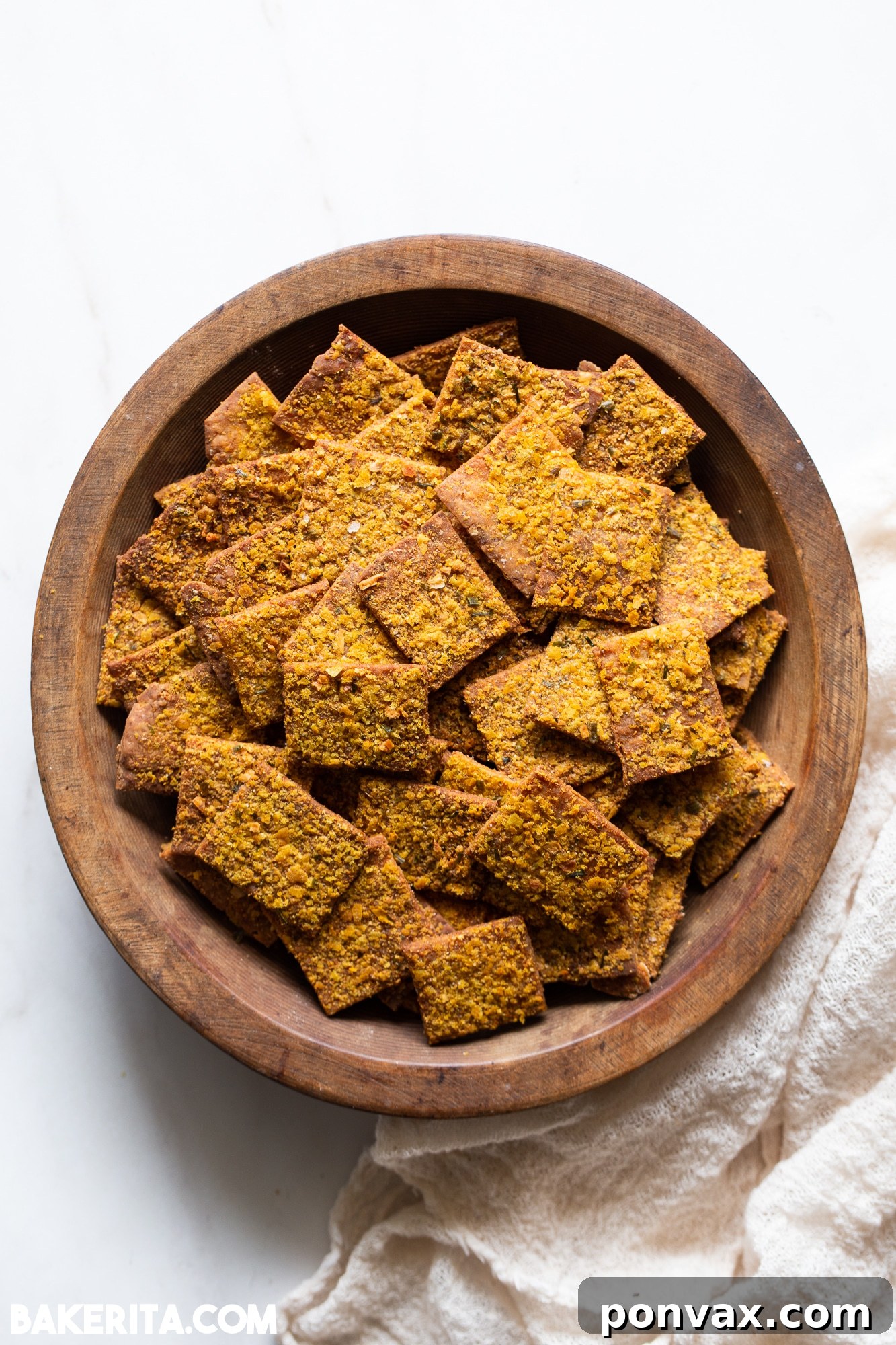 Artisan Gluten-Free Sourdough Crisps 2 Crispy gluten-free sourdough crackers on a baking sheet, ready to be served.