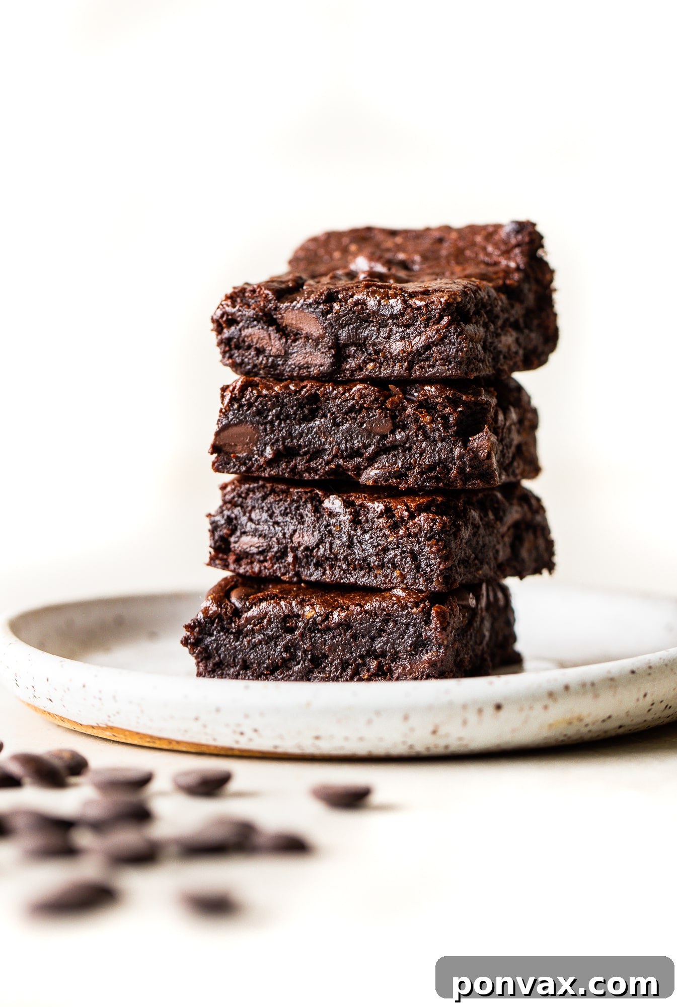 Ultimate Fudgy Vegan Gluten-Free Brownies 2 Delicious fudgy vegan gluten-free brownies on a cooling rack.