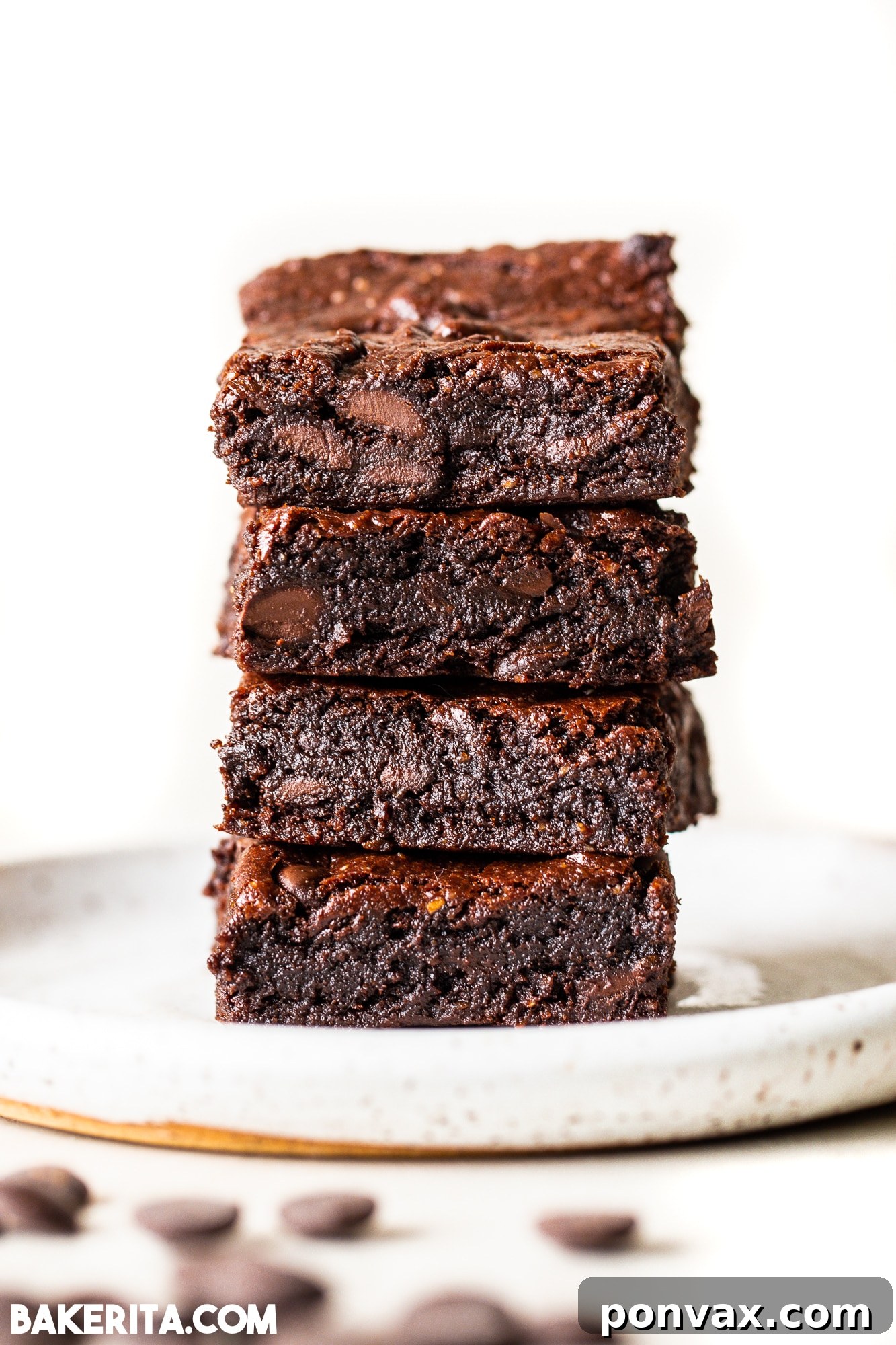 Ultimate Fudgy Vegan Gluten-Free Brownies 4 Individual vegan gluten-free brownies with a fudgy interior and chocolate chips.