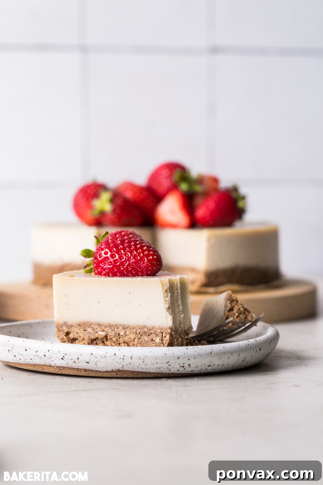 A slice of No-Bake Vegan Nut Butter Cheesecake with fresh berries