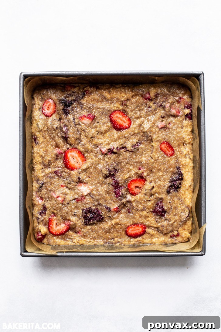 Close-up of the Berry Cornmeal Cake batter with berries folded in.