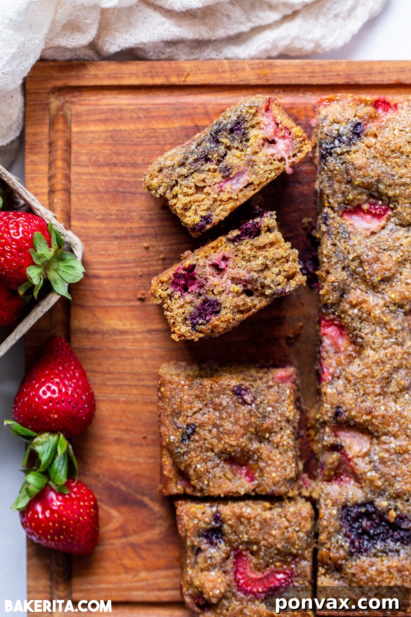 A top-down view of the freshly baked Berry Cornmeal Cake, showing the golden crust and berries.