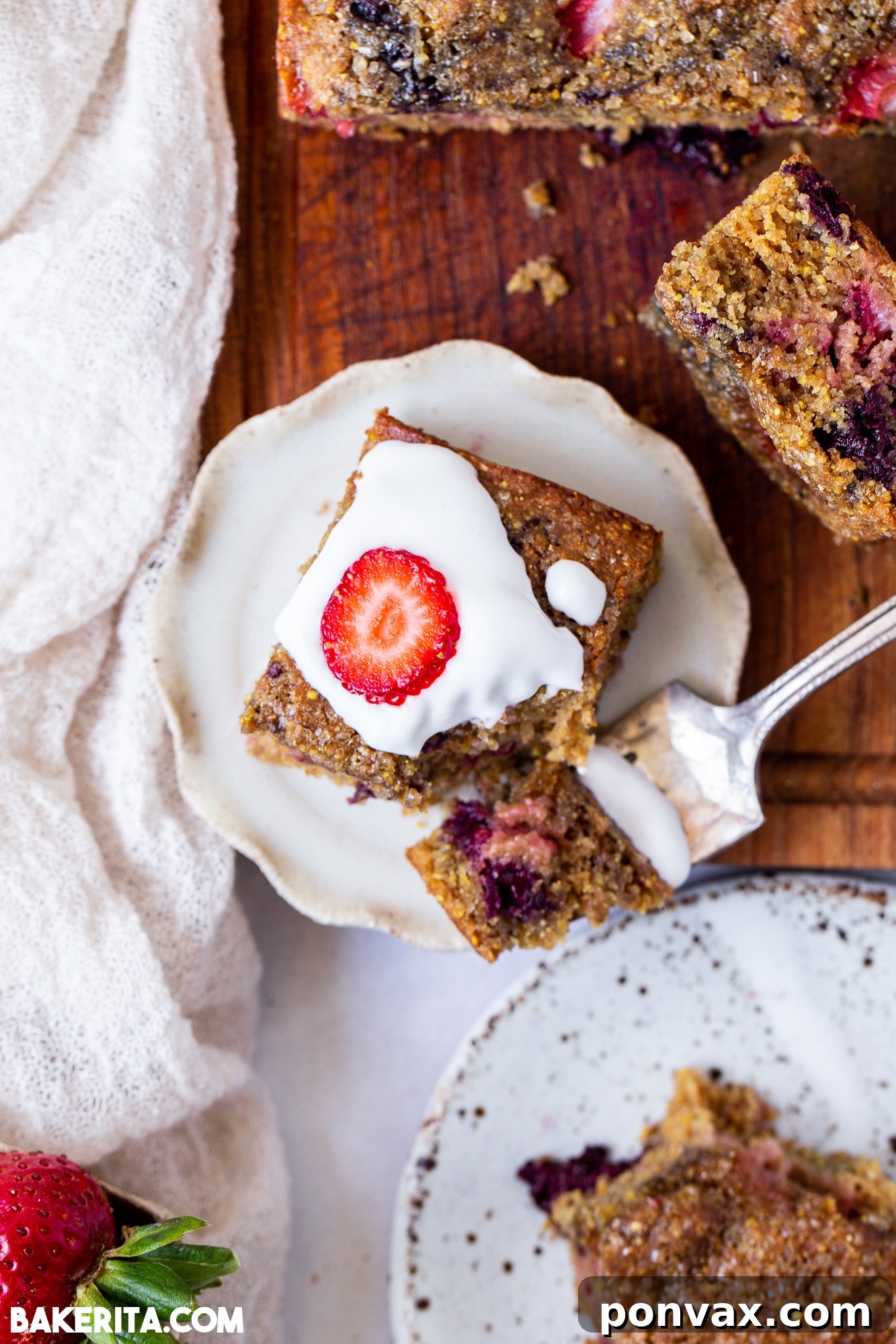 A side shot of the Berry Cornmeal Cake, highlighting its height and crumb.