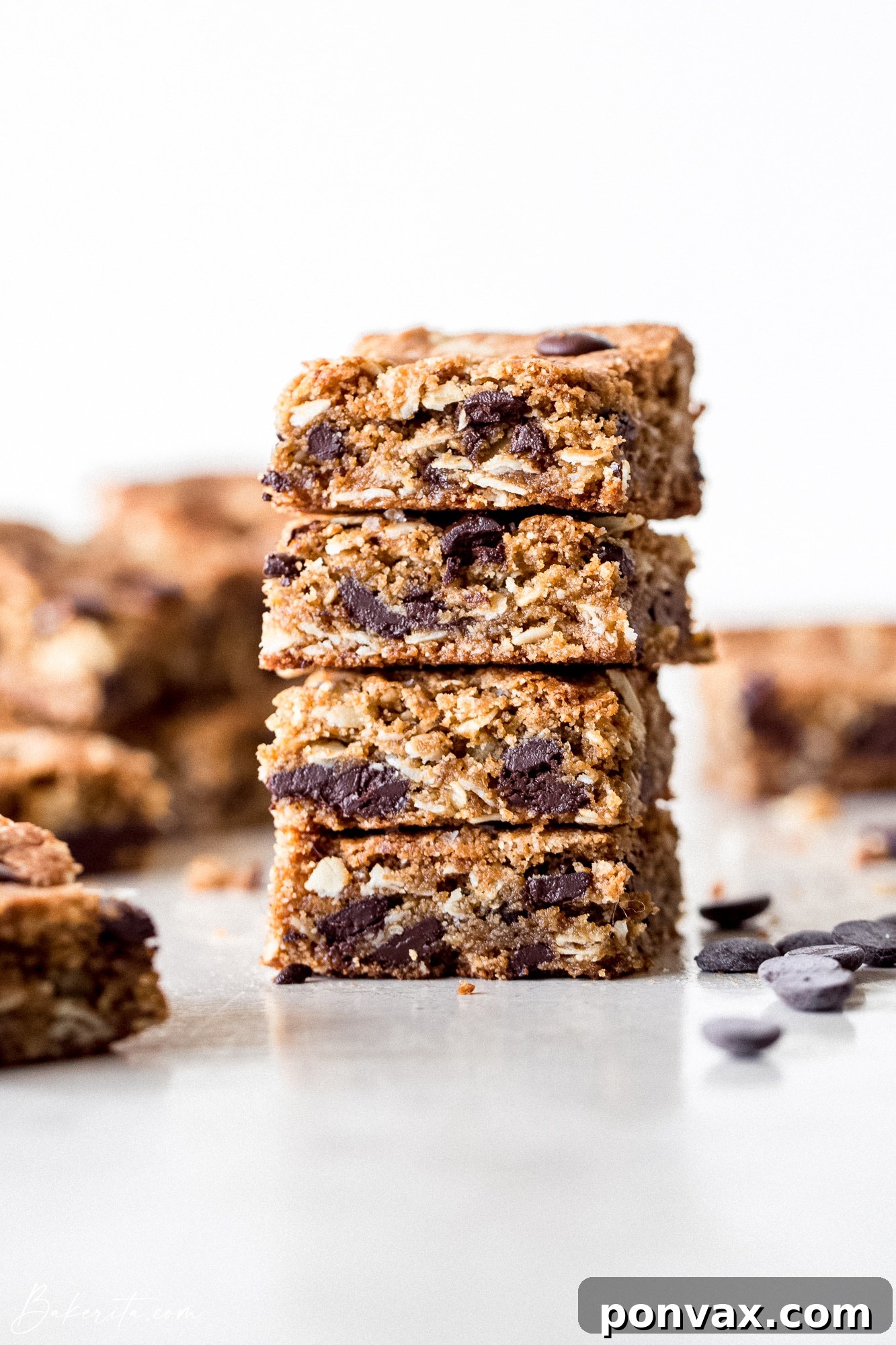Decadent Plant-Based Oat Chocolate Squares 2 Close-up of freshly baked Vegan Gluten-Free Oatmeal Chocolate Chip Bars, showing their chewy texture and melted chocolate chips.