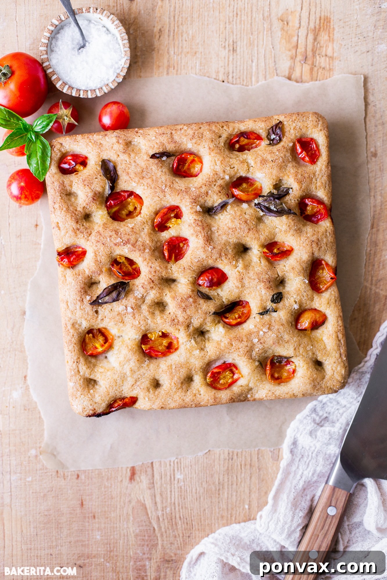 Close-up of fluffy gluten-free sourdough focaccia, showcasing its soft texture and dimpled surface.