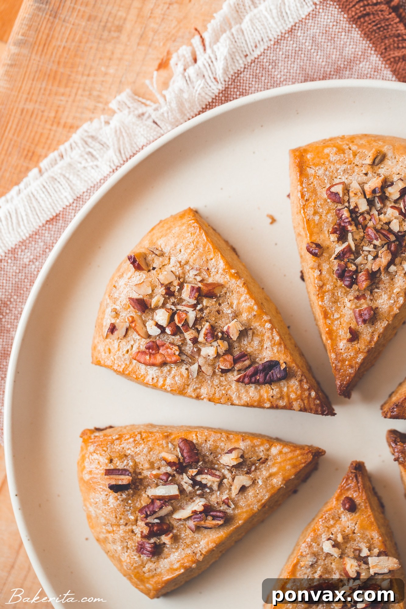 An overhead shot showcasing the warm, inviting color and rustic texture of freshly baked Gluten-Free Vegan Pumpkin Scones before glazing.