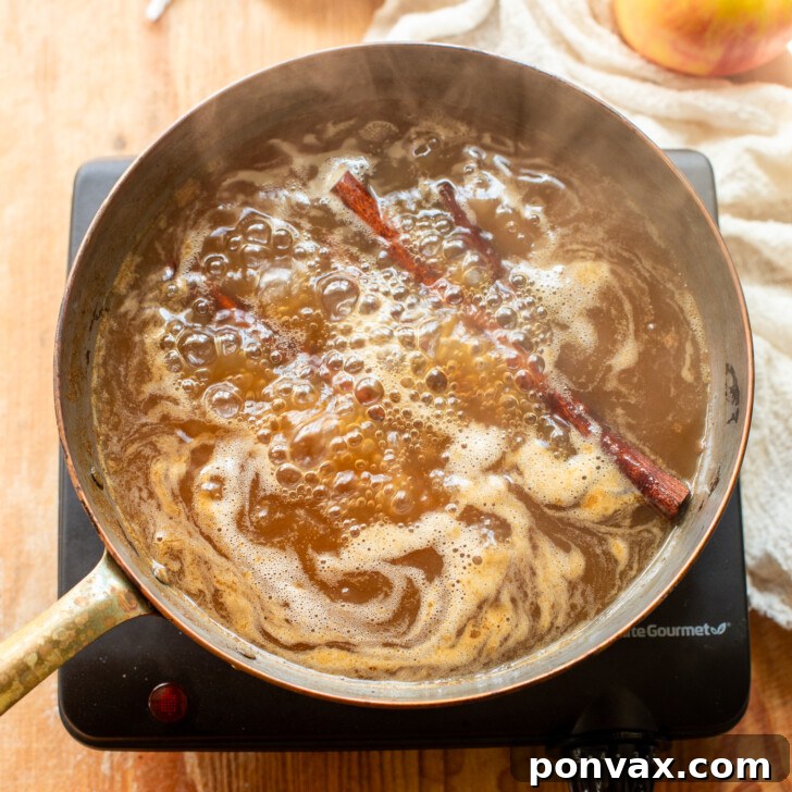 Whip Up Your Own Apple Syrup 6 Close-up of the apple syrup bubbling gently.