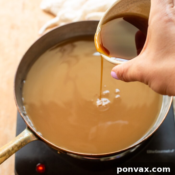 Whip Up Your Own Apple Syrup 3 Apple cider and maple syrup combined in a saucepan.