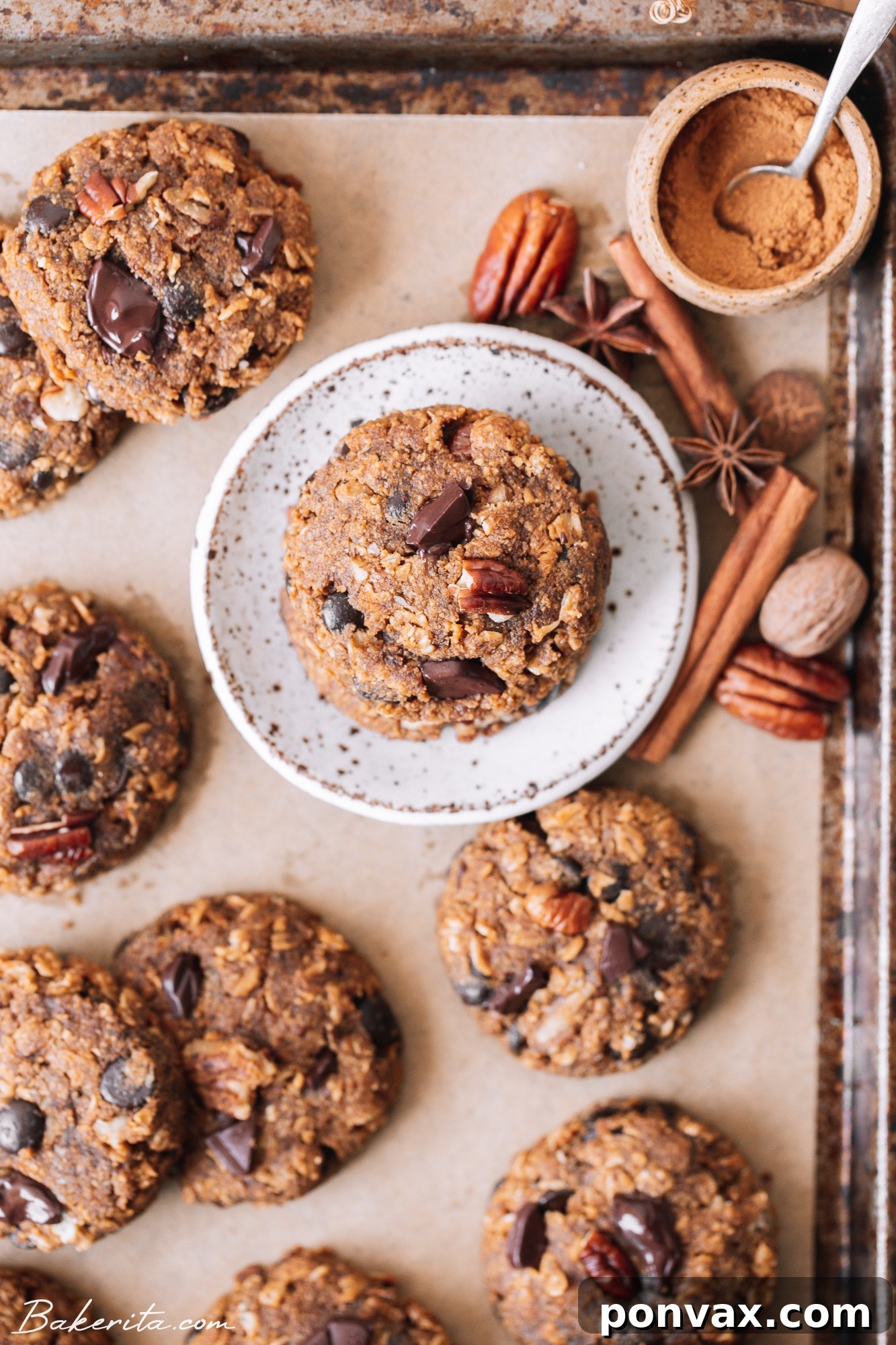 Plant-Based Pumpkin Spice Oat Delights 2 Healthy Pumpkin Oatmeal Cookies, soft, chewy, and loaded with pumpkin flavor, gluten-free rolled oats, pecans, and chocolate chips.