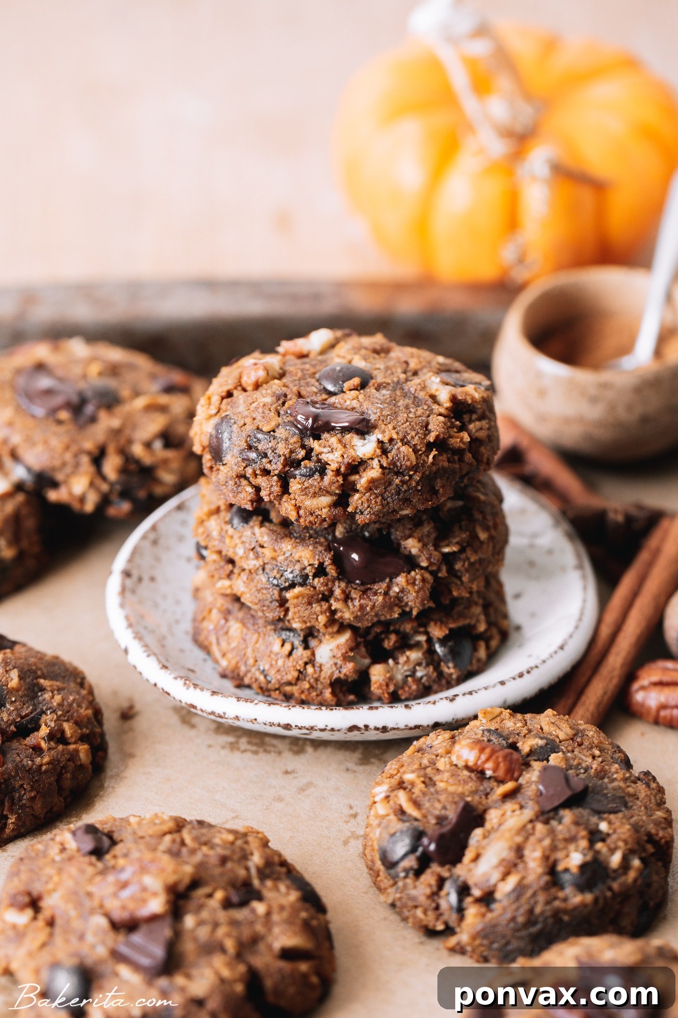 Plant-Based Pumpkin Spice Oat Delights 4 A stack of freshly baked healthy pumpkin oatmeal cookies, highlighting their golden-brown edges and inviting texture.