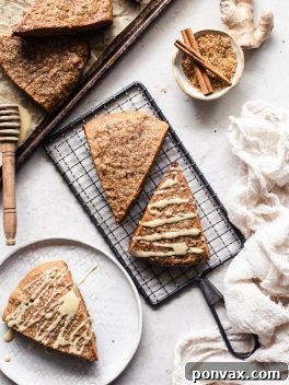 A beautifully presented vegan gingerbread scone with a golden crust and sugar dusting.