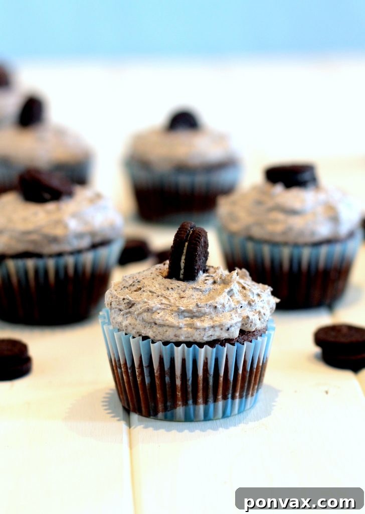 Delicious Cookies and Cream Cupcakes with an Oreo bottom and creamy frosting