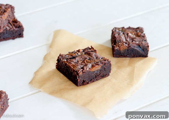 Close-up of freshly baked Salted Dulce De Leche Brownies showing the gooey caramel swirls