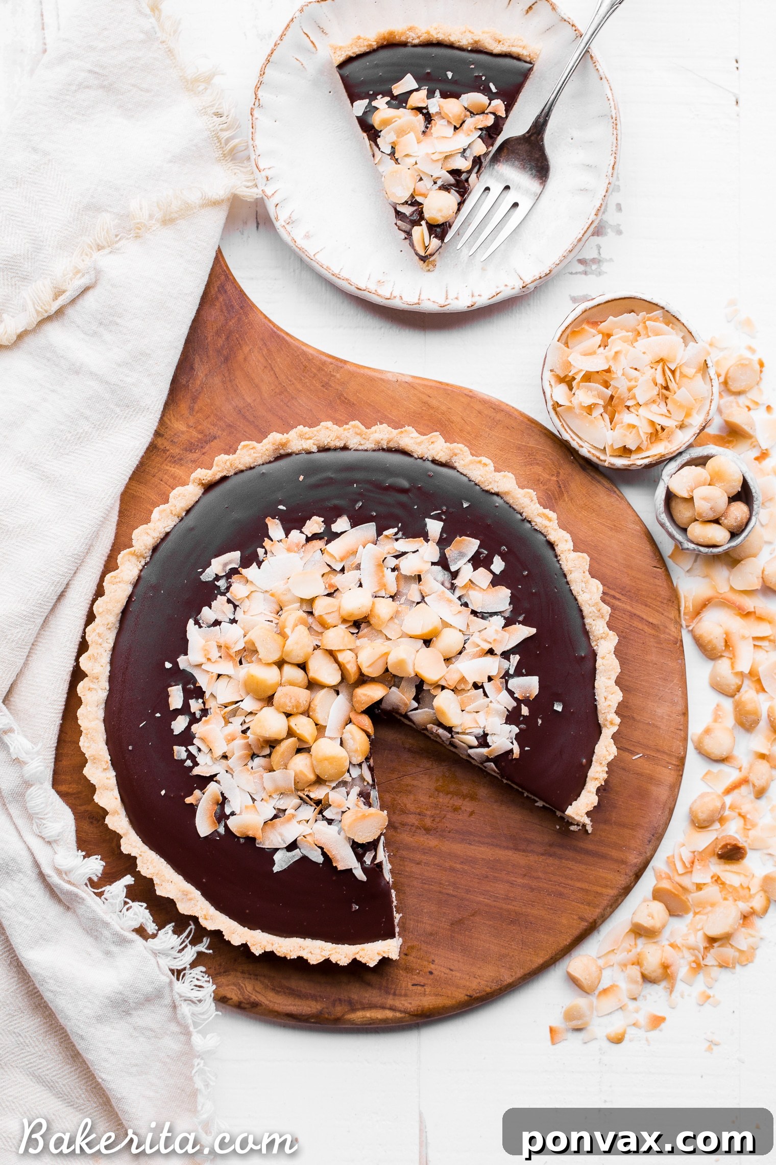 This Dark Chocolate, Coconut & Macadamia Nut Tart is decadent, delicious and easy to make. It has a coconut crust that's filled with a luscious chocolate ganache and topped with toasted coconut and macadamia nuts. You'd never guess that this nutty tart is gluten-free, vegan, Paleo, and refined sugar-free!