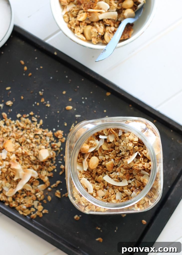 Paradise Coconut Macadamia Granola 2 Coconut Macadamia Nut Granola, an easy, healthy, gluten-free, vegan, and refined sugar-free recipe perfect for breakfast or a healthy snack. Served with yogurt and fresh berries.