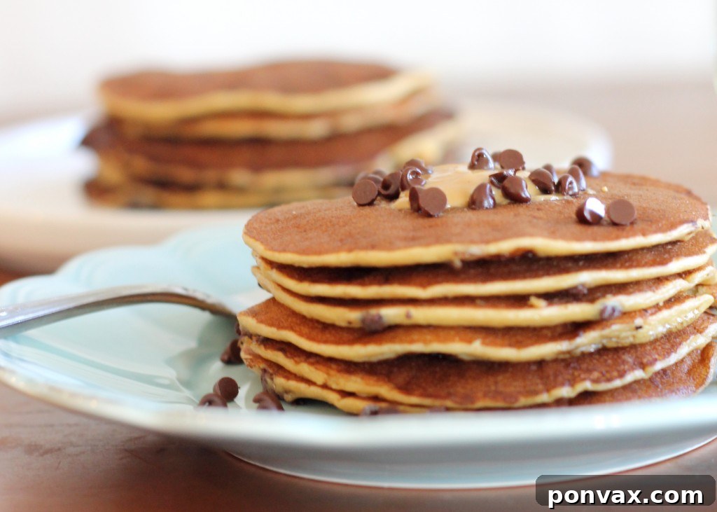 Close-up of a perfectly cooked Banana Peanut Butter Protein Pancake, showing its texture and golden-brown edges.