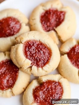These Jam Thumbprint Cookies are simple and delicious cookies made with only four ingredients! You won't be able to have just one of these gluten-free, vegan, and Paleo-friendly cookies.