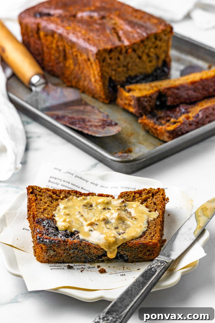 Masum Lezzet: Glutensiz Muzlu Ekmek 5 Two slices of healthy banana bread, one topped with peanut butter, beside a cup of coffee.