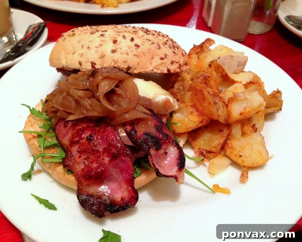 Gourmet Burger with Brie, Bacon, and Caramelized Onions from Milk in Barcelona