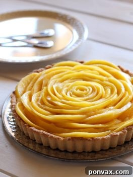 Delicious and healthy Mango Tart with a beautiful mango flower decoration.