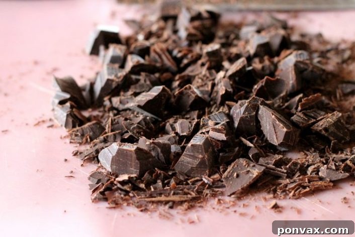 Paleo Banana Bliss Cake with Chocolate Ganache 4 A vibrant, close-up shot of the Paleo Banana Cake, showcasing its golden-brown crust and moist interior, ready to be frosted. It's a gluten-free and refined sugar-free option for a healthier dessert.